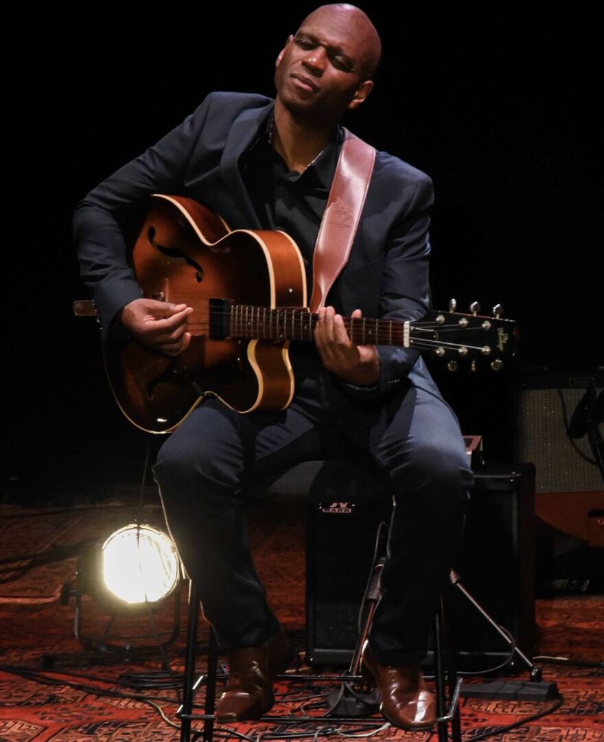 Edison Herbert playing guitar