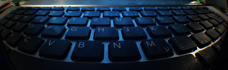 Fish eye lens view of a black computer keyboard