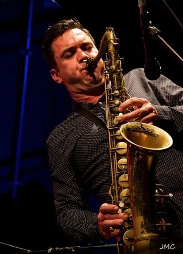 Brandon Allen playing a saxophone