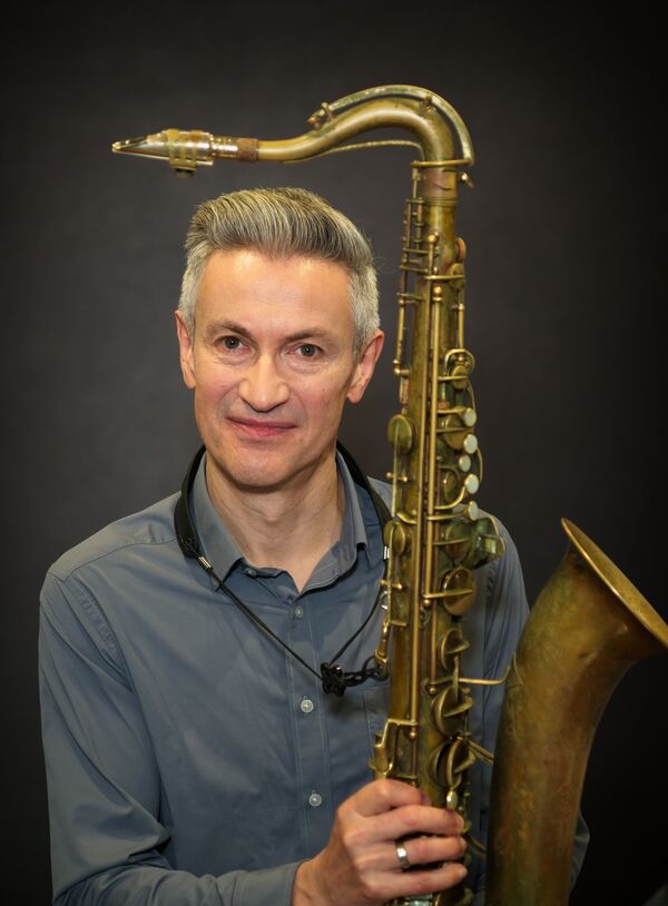 Dave O'higgins framed by his tenor sax